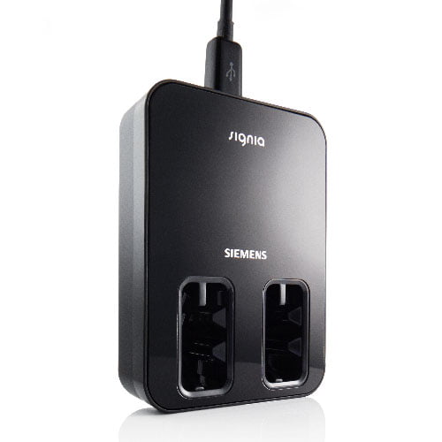 The Signia Inductive Charger E is a black hearing aid charger featuring two charging slots and a USB cable connected at the top.
