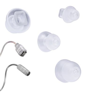 Five clear silicone eartip attachments, including the Power dome (HP receiver), are shown on a white background next to two audio device components with metal and plastic connectors.