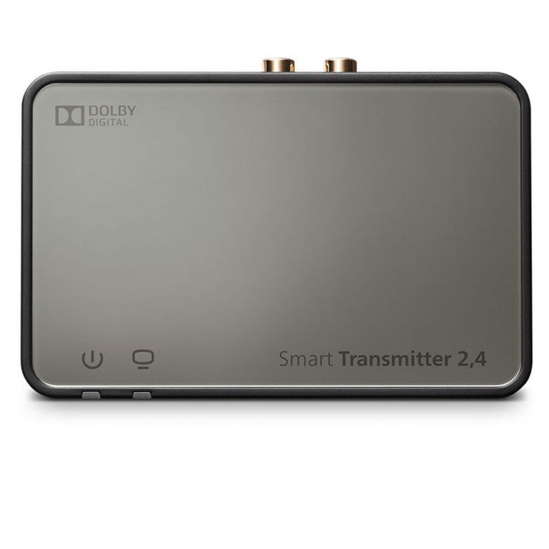 The Rexton Smart Transmitter 2.4 is a rectangular, sleek black device with a reflective "Dolby Digital" surface, power and connectivity icons, and two gold connectors on its top edge.