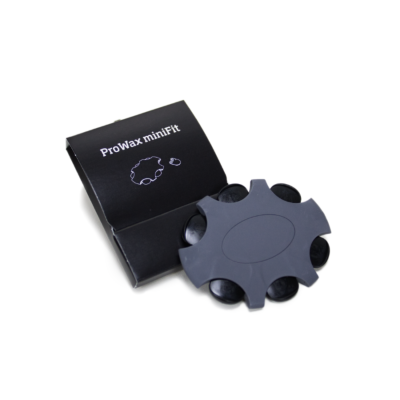 A ProWax miniFit package in black with a dark gray circular tool featuring multiple small compartments, designed for ProWax miniFit hearing aid wax guards, shown on a white background.