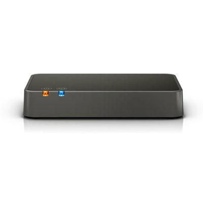 The Bernafon TV-A TV adapter is a compact black device with rounded edges and a rectangular shape, featuring orange and blue indicator lights on its front panel.