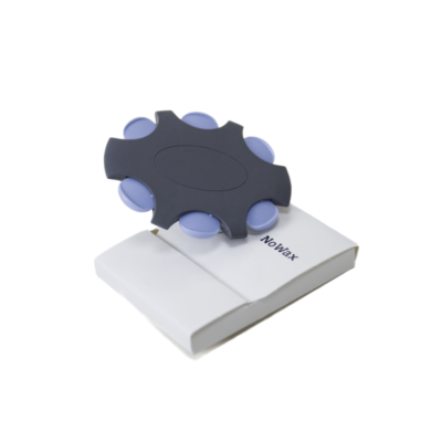 A dark gray, wheel-shaped NoWax filter with six light purple circles rests on a white rectangular case labeled "NoWax" against a plain white background.