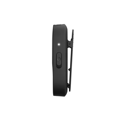 Side view of the compact black Starkey Starlink Edge Remote Microphone with a power button, white indicator light, and back clip. Shown against a plain white background.