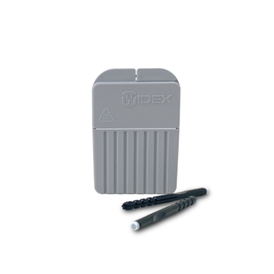 A Widex CeruStop XL hearing aid cleaning kit with a gray rectangular case, two black brushes, and the CeruStop XL Wax Guard, all displayed on a white background.