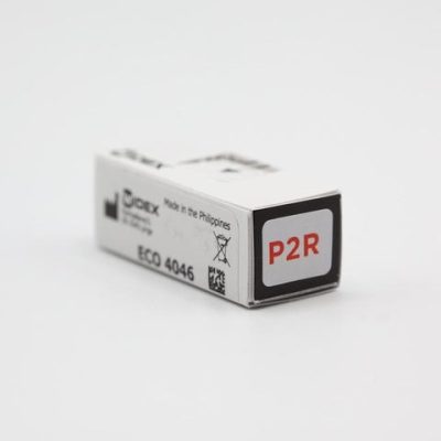 A small white box labeled P2R, with ECO 4046 and Made in the Philippines on the side, sits on a white surface—designed for Easywear wired RIC (P-Receiver) use.