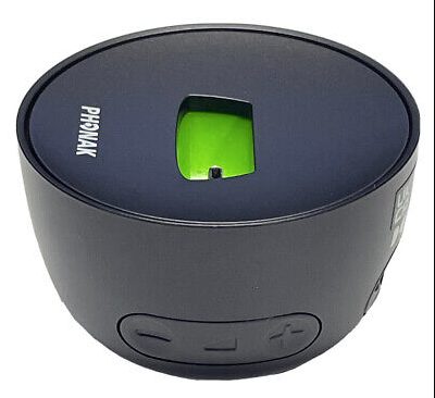 The Docking Station Roger On V2 is a black, round device with a central green-lit slot and side control buttons marked with plus and minus, designed for use with Roger On V2.