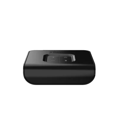 The Starkey TV is a black, rectangular device with rounded edges and a raised control panel on top featuring plus, minus, and Bluetooth buttons.